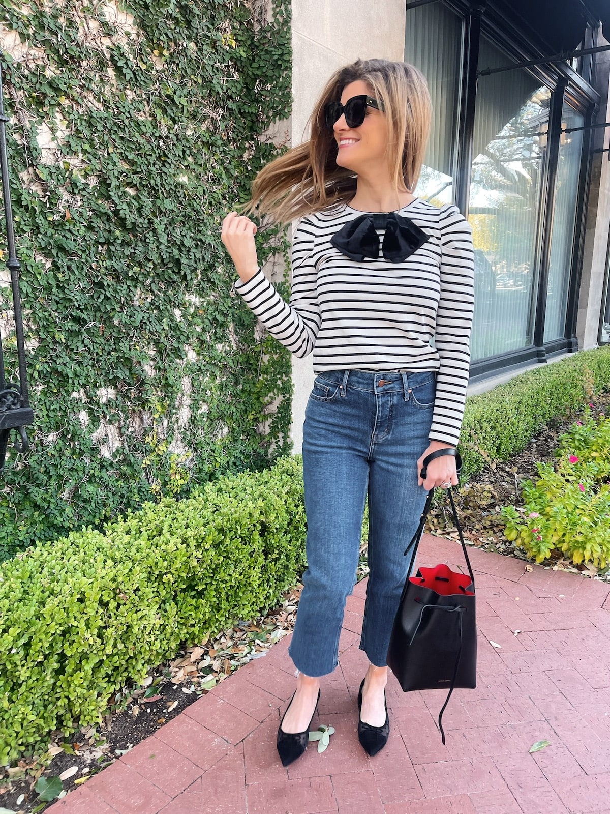 Brighton Butler wearing Boden striped top and jeans with black flats