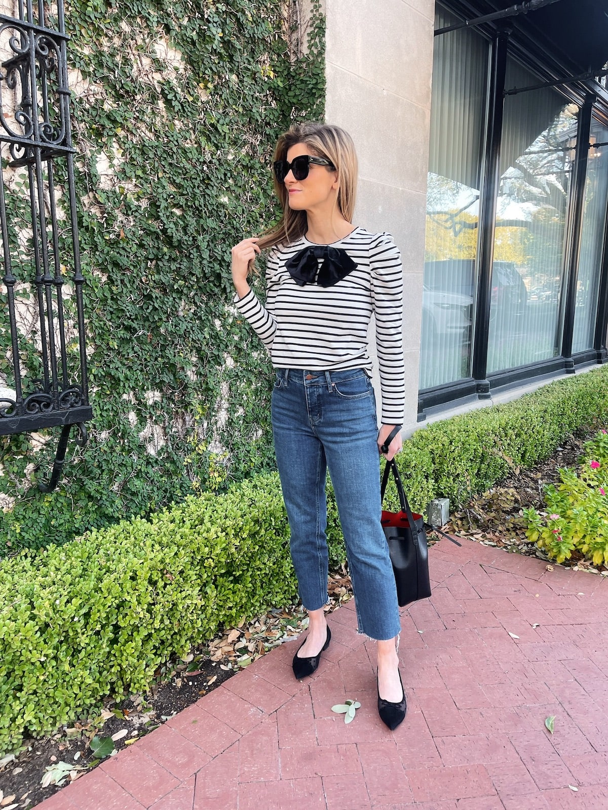 Brighton Butler wearing Boden striped top and jeans with black flats