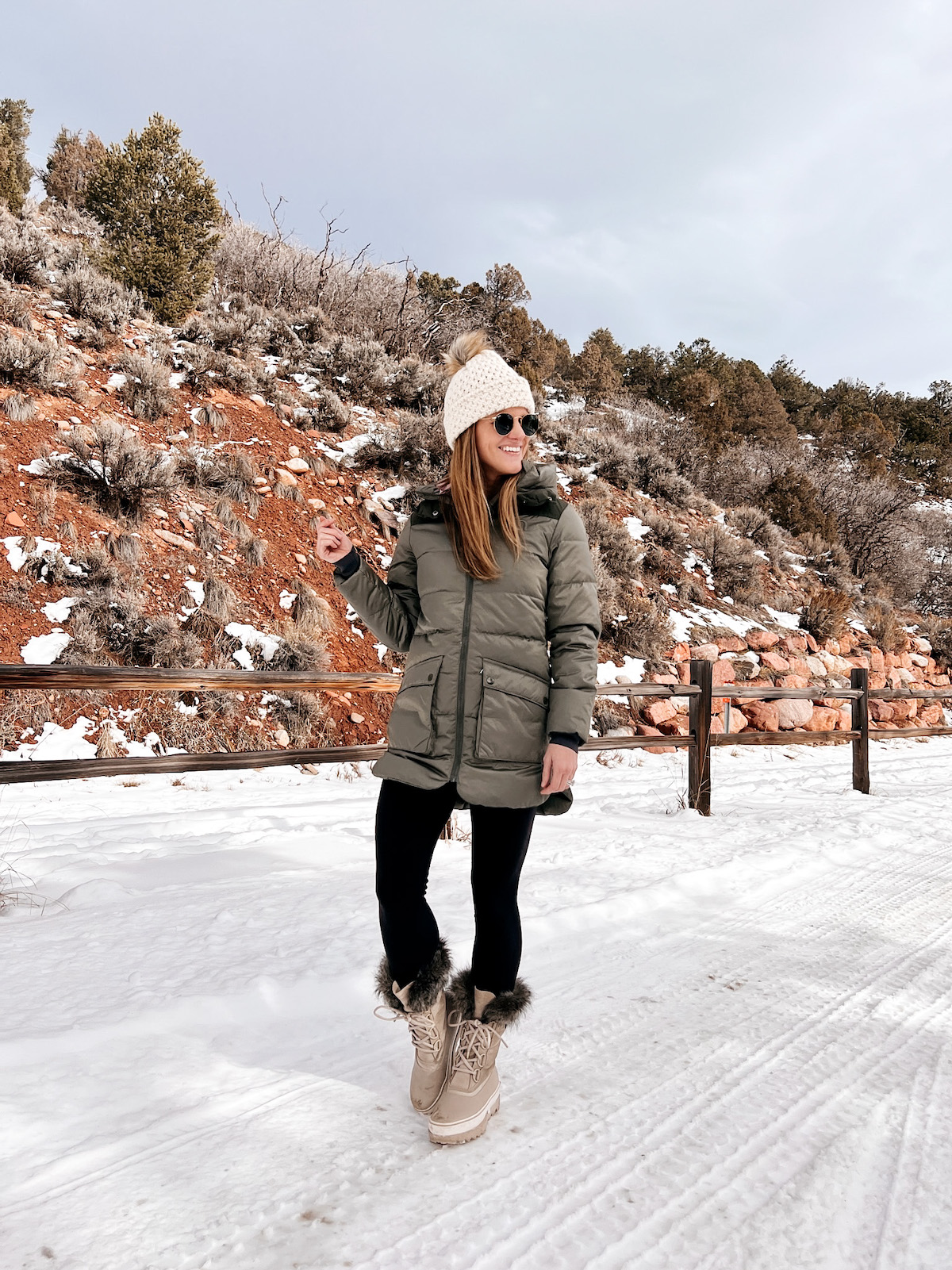 Backcountry green parka and beyond yoga leggings with sorel boots