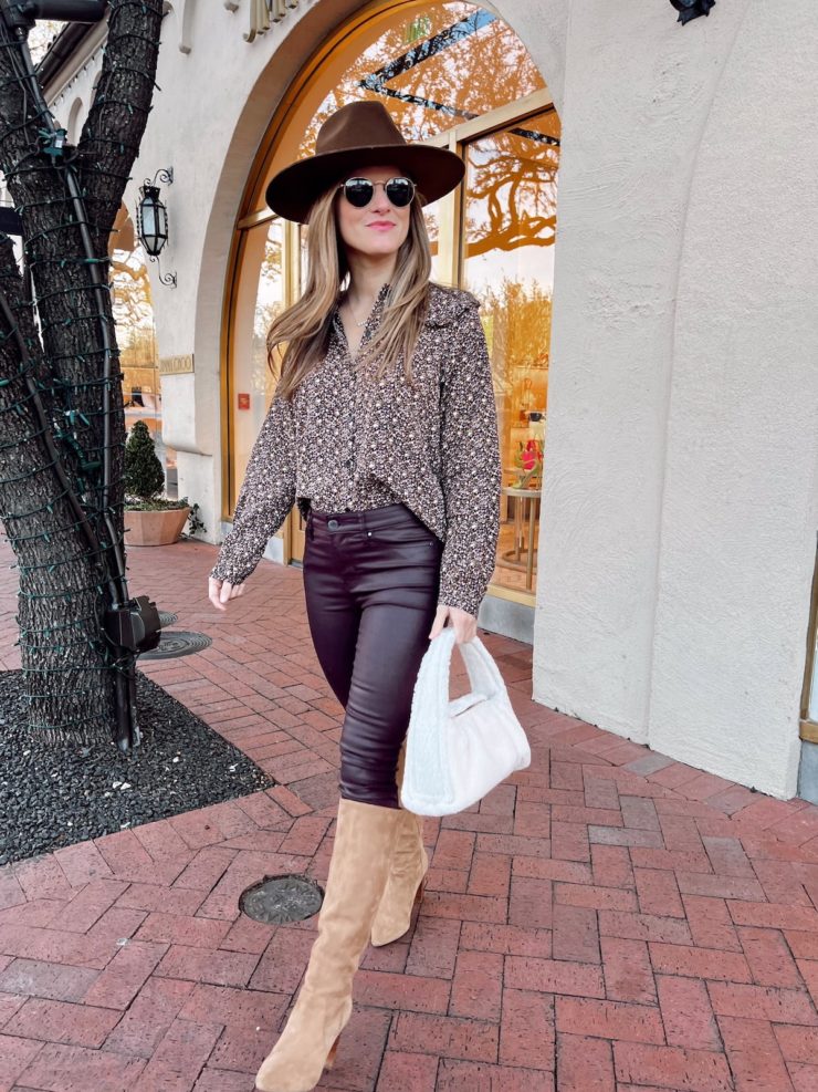 Brighton Butler wearing Stella Nova floral top with WHBM purple coated pants and sherpa purse
