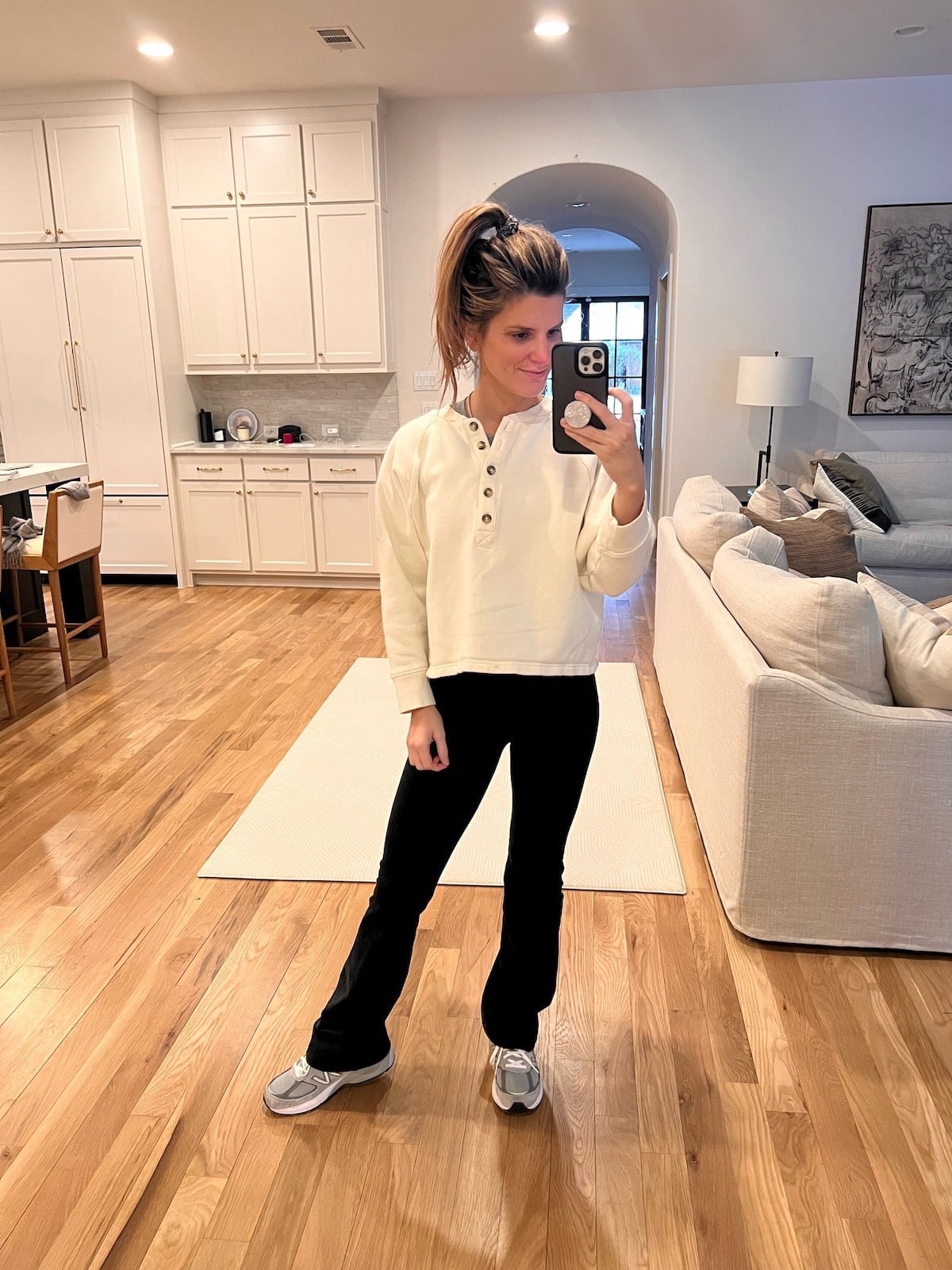Brighton Butler wearing beyond yoga flares and madewell sweater