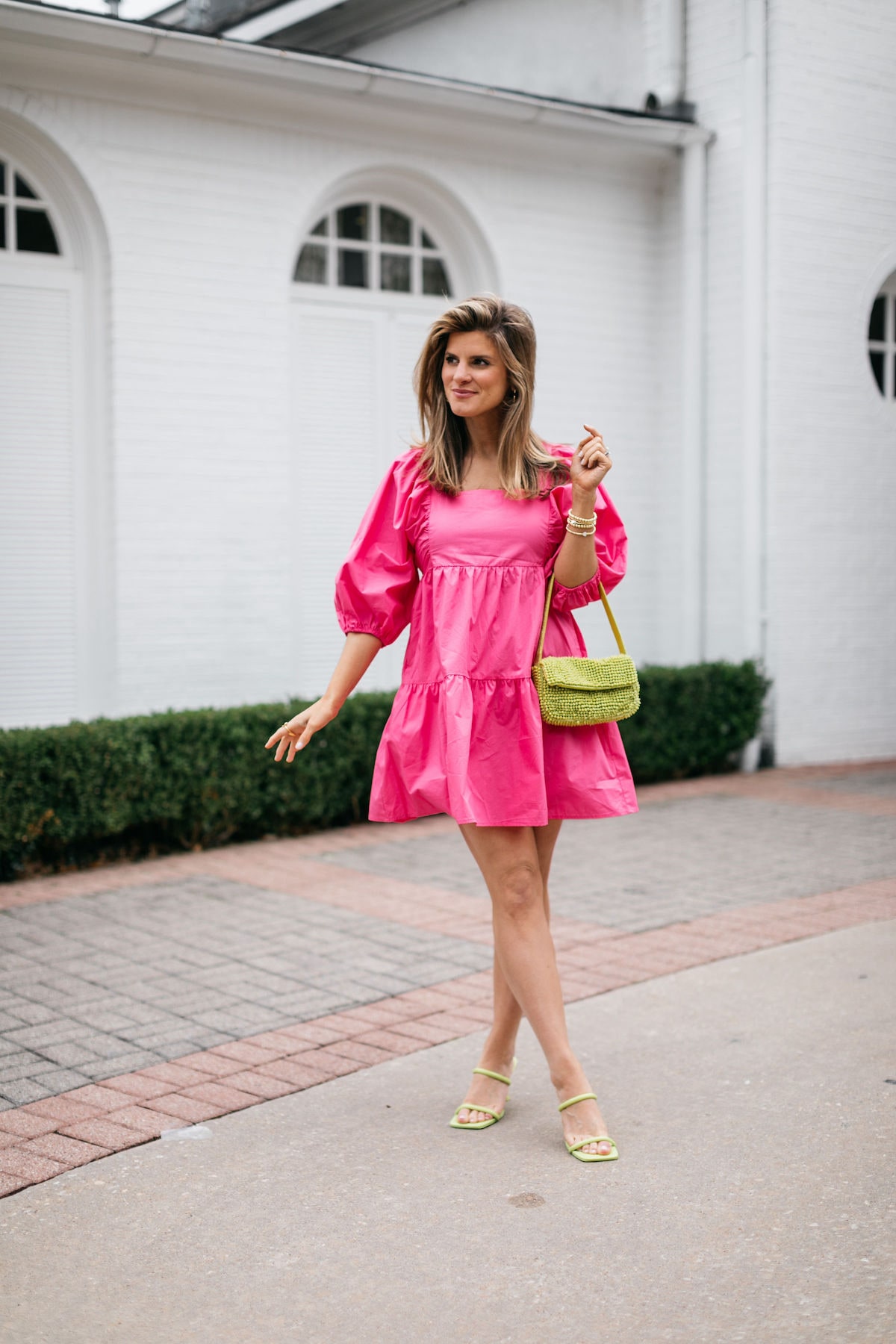 Brighton Butler wearing pink target dress and mango green beaded spring bag