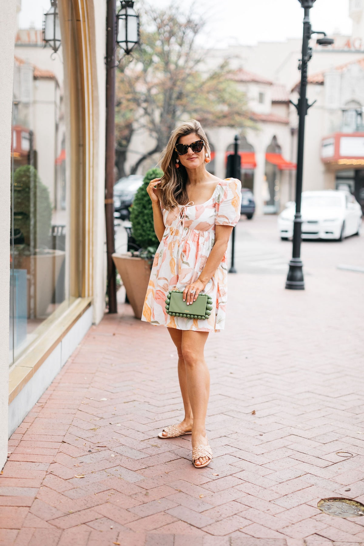 Brighton Butler wearing abercrombie mini dress with coral heels and cult gaia bag