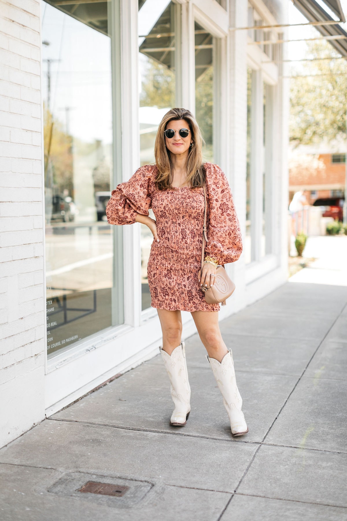 Brighton Butler wearing free people smocked dress and miron crosby boots