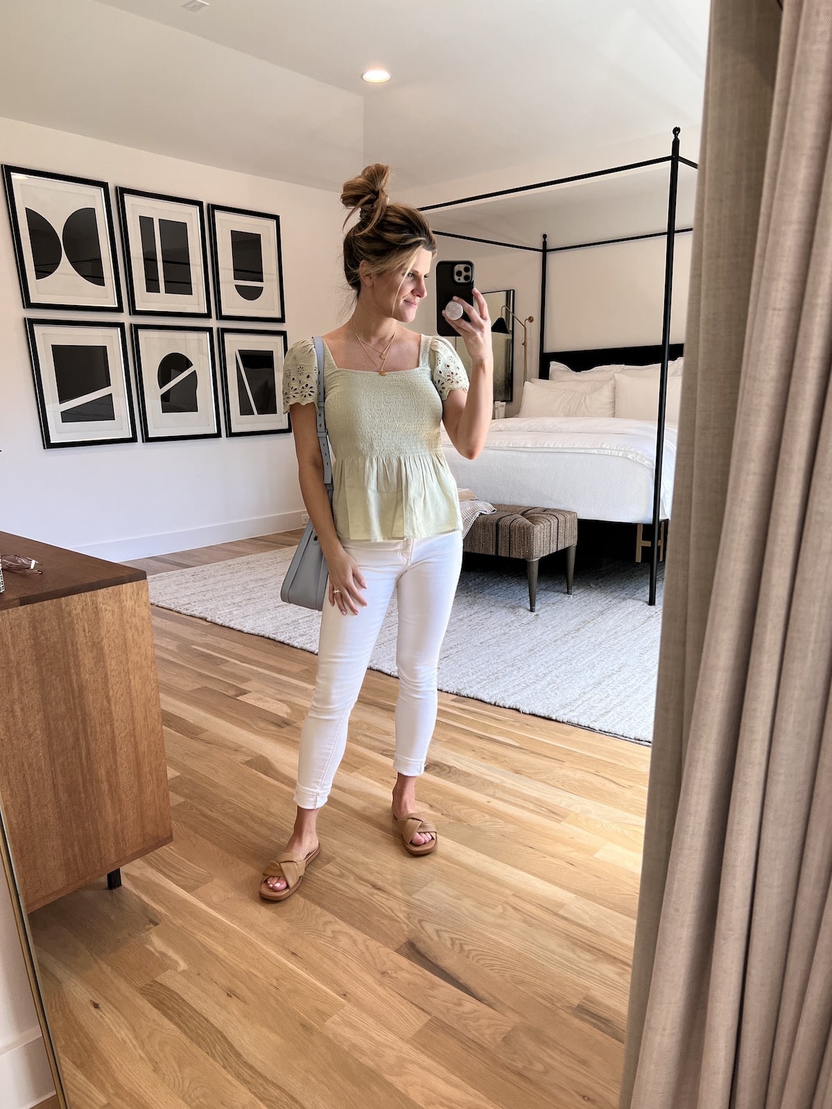 Brighton Butler wearing madewell white jeans and mint top