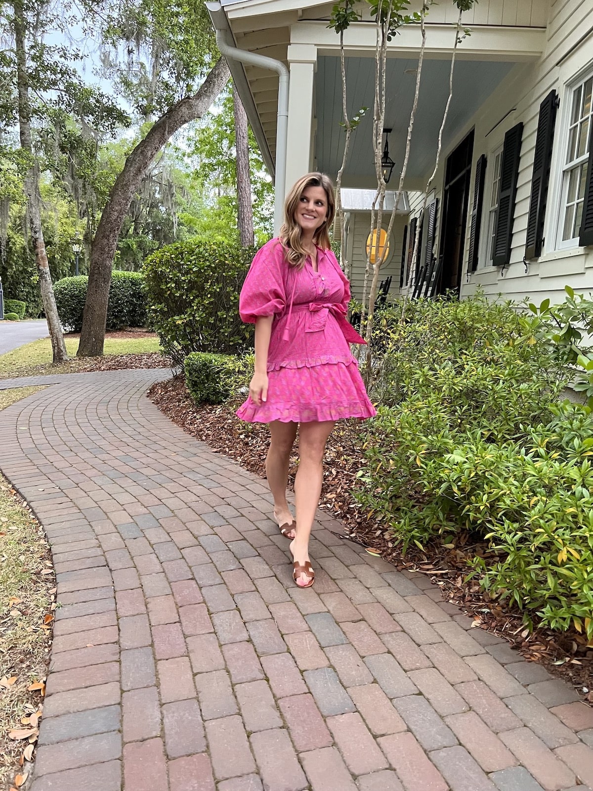 Brighton Butler wearing pink cleobella dress with hermes sandals in palmetto bluff sandal review