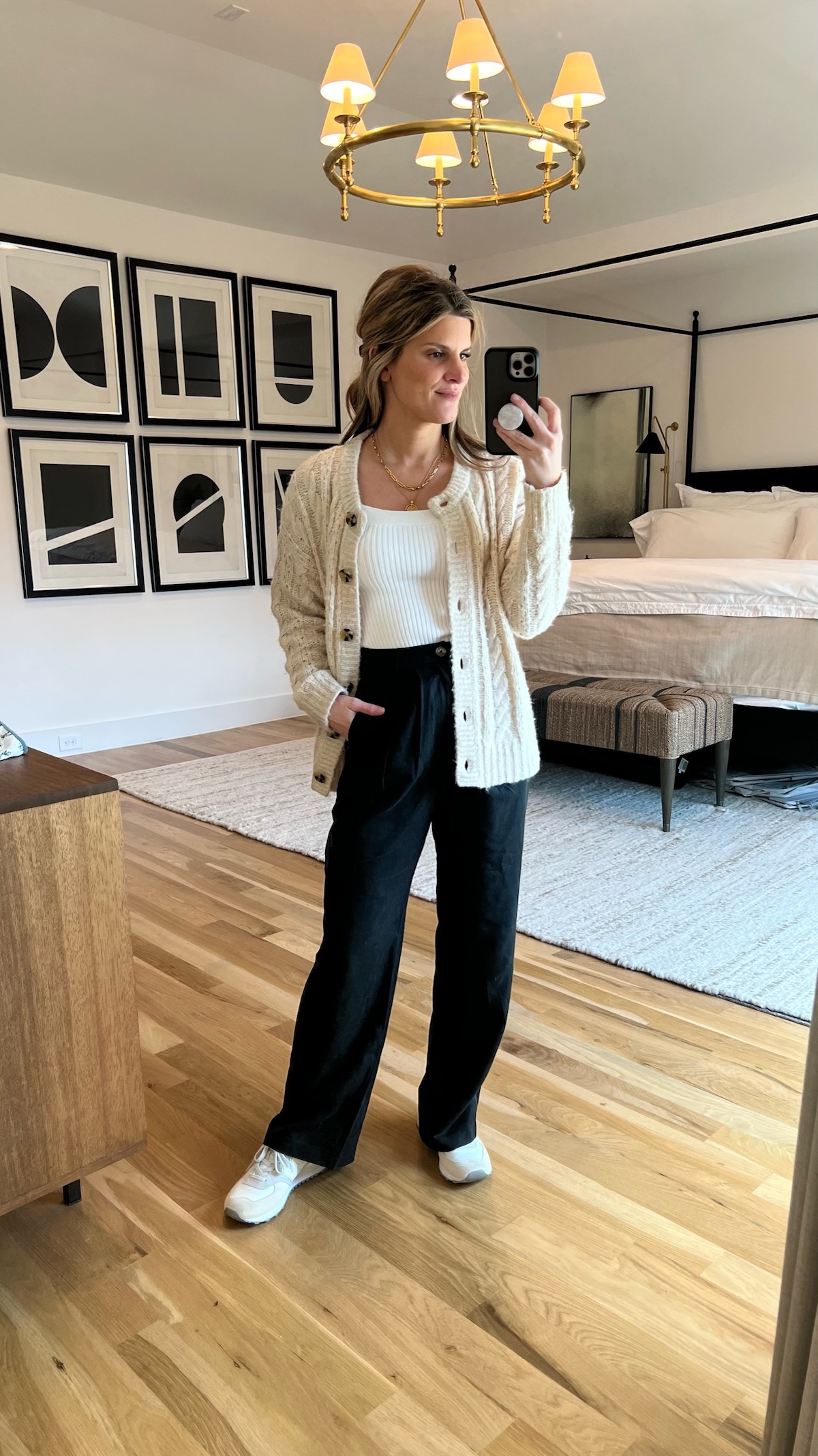 Brighton Butler wearing reformation trousers with abercrombie tank